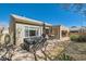 Inviting backyard showcasing the hot tub, covered patio, and dining set, perfect for entertaining at 2705 Cuckoo Shrike Ave, North Las Vegas, NV 89084