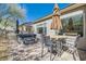 Wonderful backyard featuring a hot tub, patio dining set, and tasteful landscaping at 2705 Cuckoo Shrike Ave, North Las Vegas, NV 89084