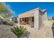 Nice backyard featuring a covered patio, decorative rock, and block wall fencing at 2705 Cuckoo Shrike Ave, North Las Vegas, NV 89084