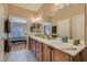 Bright bathroom with dual sinks and views to the bedroom at 2705 Cuckoo Shrike Ave, North Las Vegas, NV 89084