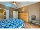 Well-lit bedroom boasts wood floors and multiple doorways to the hall and bathroom at 2705 Cuckoo Shrike Ave, North Las Vegas, NV 89084