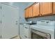 Functional laundry area with side by side washer and dryer and lots of storage at 2705 Cuckoo Shrike Ave, North Las Vegas, NV 89084