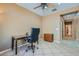Comfortable office features tile flooring and a view to the hallway at 2705 Cuckoo Shrike Ave, North Las Vegas, NV 89084