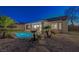 Backyard pool features a rock detail with beautiful palm trees surrounding at 2820 Thunder Bay Ave, Henderson, NV 89052