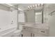 Neutral bathroom with a shower-tub combo, single vanity, and updated fixtures at 2966 Juniper Hills Blvd # 204, Las Vegas, NV 89142