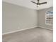 A bright bedroom features wood-look flooring and a ceiling fan at 2966 Juniper Hills Blvd # 204, Las Vegas, NV 89142