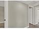 Bright hallway featuring neutral paint and trim and doors to bedrooms and closets at 2966 Juniper Hills Blvd # 204, Las Vegas, NV 89142