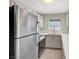Bright kitchen featuring stainless steel appliances, white cabinets, quartz countertops and a window at 2966 Juniper Hills Blvd # 204, Las Vegas, NV 89142