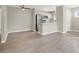 Inviting living room offering contemporary flooring, a ceiling fan, and an open design leading to the kitchen at 2966 Juniper Hills Blvd # 204, Las Vegas, NV 89142