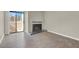 Living room with sliding glass doors to the patio, fireplace, and neutral color palette at 2966 Juniper Hills Blvd # 204, Las Vegas, NV 89142