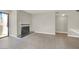 Living room with sliding glass doors to the patio, fireplace, and views at 2966 Juniper Hills Blvd # 204, Las Vegas, NV 89142