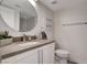 Stylish bathroom featuring a modern vanity, round mirror, and sleek fixtures at 3012 Waterside Cir, Las Vegas, NV 89117