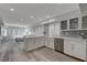 Spacious kitchen featuring stainless steel appliances, breakfast bar, and modern lighting at 3012 Waterside Cir, Las Vegas, NV 89117