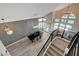 Elevated view of the dining and living area featuring modern chandeliers and high ceilings at 3012 Waterside Cir, Las Vegas, NV 89117