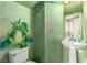 Whimsical bathroom with pedestal sink and custom frog mural at 3098 Quail Crest Ave, Henderson, NV 89052