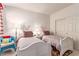 Cozy bedroom features two twin beds, plush pillows, and a bright, inviting atmosphere at 3098 Quail Crest Ave, Henderson, NV 89052