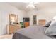 Bright bedroom with a comfortable bed, dresser, television and outdoor access at 3098 Quail Crest Ave, Henderson, NV 89052