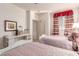 Comfortable bedroom boasts twin beds, a desk, and a well-lit ambiance at 3098 Quail Crest Ave, Henderson, NV 89052