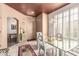 Cozy dining area with a glass-top table, decorative lighting, and a charming entryway view at 3098 Quail Crest Ave, Henderson, NV 89052