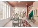 Bright dining room with large windows, a glass-top table, and access to the living area at 3098 Quail Crest Ave, Henderson, NV 89052