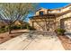 Beautiful two-story house with a tiled roof, two-car garage, trees, and well-maintained front yard at 3098 Quail Crest Ave, Henderson, NV 89052