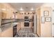 Well-lit kitchen featuring stainless steel appliances and ample counter space at 3098 Quail Crest Ave, Henderson, NV 89052