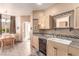 Kitchen with sink, dishwasher and dining area in the background at 3098 Quail Crest Ave, Henderson, NV 89052