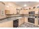 Traditional kitchen featuring linoleum flooring, countertops, and ample wooden cabinetry at 3098 Quail Crest Ave, Henderson, NV 89052