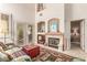 Inviting living room featuring a fireplace, French doors, and stylish decor at 3098 Quail Crest Ave, Henderson, NV 89052