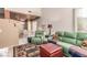 Cozy living room features a vaulted ceiling and comfortable green furniture at 3098 Quail Crest Ave, Henderson, NV 89052