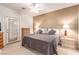 Comfortable main bedroom with neutral tones and outdoor access at 3098 Quail Crest Ave, Henderson, NV 89052