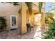 Charming patio features a table set, stone pavers, and lush plants at 3098 Quail Crest Ave, Henderson, NV 89052