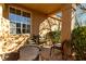 Inviting covered patio with comfortable seating and shade at 3098 Quail Crest Ave, Henderson, NV 89052