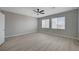 Spacious main bedroom with light gray walls and two windows offering plenty of light at 316 Blackstone River Ave, Las Vegas, NV 89148