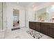 Bright bathroom featuring double vanity, soaking tub, and luxurious glass shower at 350 Gandara St, Las Vegas, NV 89138