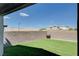 A backyard featuring artificial turf and a block wall surrounding the property at 3524 Crotone Ave, Henderson, NV 89044