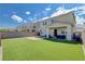 A backyard featuring artificial turf, a covered patio, and a basketball hoop at 3524 Crotone Ave, Henderson, NV 89044