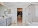 Bathroom showcases double sinks, glass shower, and a walk-in closet at 3524 Crotone Ave, Henderson, NV 89044