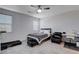 Neutral bedroom with a ceiling fan, gray carpet, and a desk for a work space at 3524 Crotone Ave, Henderson, NV 89044