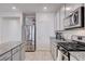 Bright kitchen with stainless steel appliances, granite countertops and ample storage at 3524 Crotone Ave, Henderson, NV 89044