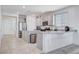 Bright kitchen features stainless appliances, light gray cabinets, and granite countertops at 3524 Crotone Ave, Henderson, NV 89044