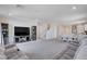 The living room and dining area are connected to the kitchen, creating an open space for gathering at 3524 Crotone Ave, Henderson, NV 89044