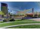 Outdoor park featuring a shaded area, landscaping, and paved walkway at 3524 Crotone Ave, Henderson, NV 89044