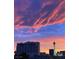 Striking city skyline at sunset, featuring colorful clouds and iconic buildings at 353 E Bonneville Ave # 447, Las Vegas, NV 89101