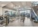 Bright gym with modern equipment and large windows overlooking the city skyline at 353 E Bonneville Ave # 447, Las Vegas, NV 89101
