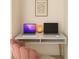 Stylish home office setup with marble desk, modern art, and comfortable pink chair at 353 E Bonneville Ave # 447, Las Vegas, NV 89101
