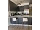 Modern kitchen with stainless steel appliances, sleek cabinetry, and stylish counter seating at 353 E Bonneville Ave # 447, Las Vegas, NV 89101
