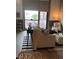 Cozy living area with balcony access and neutral decor at 353 E Bonneville Ave # 447, Las Vegas, NV 89101