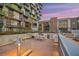 Outdoor kitchen equipped with grills and a dining area, great for entertaining with views of the city skyline at 353 E Bonneville Ave # 447, Las Vegas, NV 89101