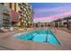 Exterior pool area offers a resort-like experience with pristine blue waters and comfortable lounge seating at 353 E Bonneville Ave # 447, Las Vegas, NV 89101